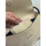 Prada Arqué leather shoulder bag with flap